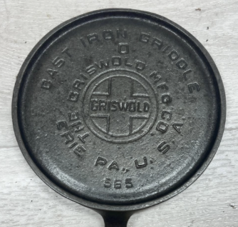 Bottom of Griswold no. 0 cast iron Toy Griddle, large block logo EPU, pattern number 565. Sold for $550.